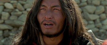 Movie still from “Himalaya” (1999), directed by Eric Valli – A person with long black hair; Close Up shot, Low angle