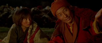 Movie still from “Himalaya” (1999), directed by Eric Valli – Two young boys are posing for a picture; Close Up shot, High angle