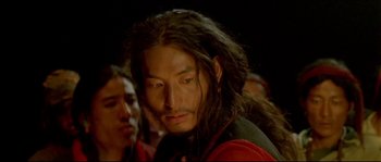 Movie still from “Himalaya” (1999), directed by Eric Valli – A person with long black hair; Close Up shot, Low angle