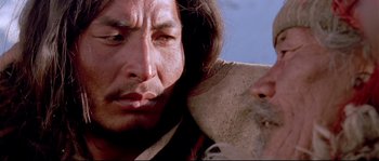 Movie still from “Himalaya” (1999), directed by Eric Valli – A man's face with a beard; Close Up shot, Over the shoulder angle