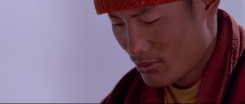 Movie still from “Himalaya” (1999), directed by Eric Valli – A person wearing a hat; Extreme Close Up shot, High angle