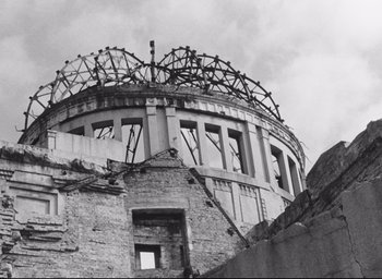 Movie still from “Hiroshima Mon Amour” (1959), directed by Alain Resnais – An old building that has been demolished and torn down; Extreme Wide shot, Low angle