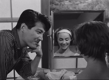 Movie still from “Hiroshima Mon Amour” (1959), directed by Alain Resnais – A black and white photo of a man and a woman looking at each other; Close Up shot, Over the shoulder angle
