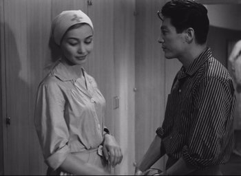 Movie still from “Hiroshima Mon Amour” (1959), directed by Alain Resnais – A man and a woman standing next to each other; Medium shot, Over the shoulder angle