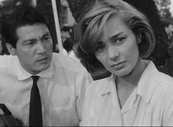 Movie still from “Hiroshima Mon Amour” (1959), directed by Alain Resnais – A man and a woman standing next to each other; Close Up shot, Over the shoulder angle