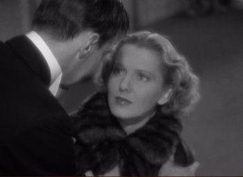 Movie still from “History Is Made at Night” (1937), directed by Frank Borzage – A man and a woman are looking at one another; Close Up shot, High angle