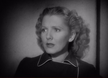 Movie still from “History Is Made at Night” (1937), directed by Frank Borzage – An old black and white photo of a woman with curly hair; Close Up shot, High angle