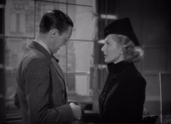 Movie still from “History Is Made at Night” (1937), directed by Frank Borzage – A man and a woman standing next to each other; Medium shot, Over the shoulder angle