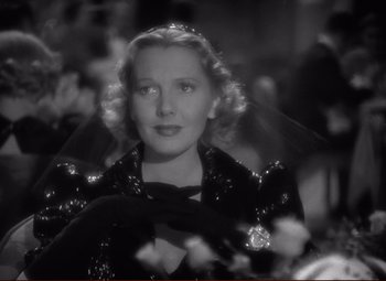 Movie still from “History Is Made at Night” (1937), directed by Frank Borzage – A black and white photo of a woman with a veil; Close Up shot, Low angle