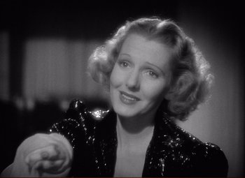 Movie still from “History Is Made at Night” (1937), directed by Frank Borzage – An old photo of a woman in a black jacket; Close Up shot, Low angle