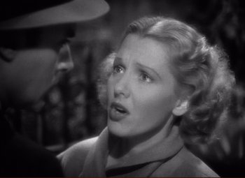 Movie still from “History Is Made at Night” (1937), directed by Frank Borzage – An old photo of a woman looking surprised; Close Up shot, High angle