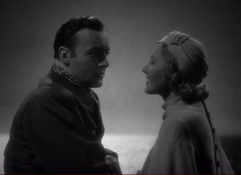 Movie still from “History Is Made at Night” (1937), directed by Frank Borzage – An old photo of a man and a woman; Close Up shot, Low angle