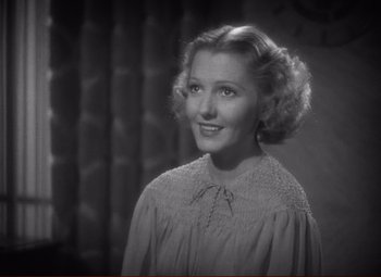 Movie still from “History Is Made at Night” (1937), directed by Frank Borzage – An old photo of an older woman in a dress; Close Up shot, High angle