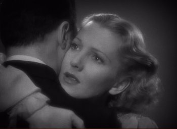 Movie still from “History Is Made at Night” (1937), directed by Frank Borzage – An old black and white photo of a man and a woman; Close Up shot, High angle