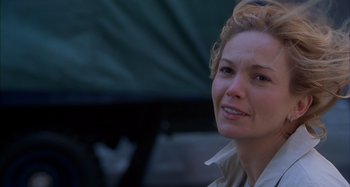 Movie still from “Unfaithful” (2002), directed by Adrian Lyne – A person wearing a white shirt; Close Up shot, Over the shoulder angle