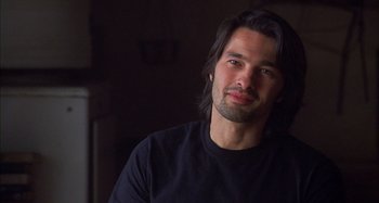 Movie still from “Unfaithful” (2002), directed by Adrian Lyne – A person with long black hair; Close Up shot, Over the shoulder angle
