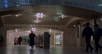 Movie still from “Unfaithful” (2002), directed by Adrian Lyne – A person walking in a hallway near a building; Extreme Wide shot, High angle