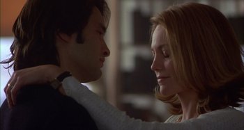 Movie still from “Unfaithful” (2002), directed by Adrian Lyne – A man and a woman looking into each others eyes; Close Up shot, Low angle