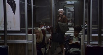 Movie still from “Unfaithful” (2002), directed by Adrian Lyne – A group of people riding on a subway train; Wide shot, High angle