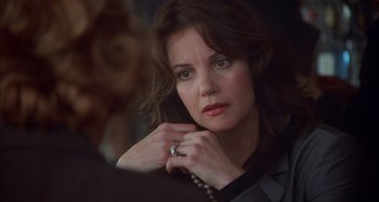 Movie still from “Unfaithful” (2002), directed by Adrian Lyne – A person talking on a cell phone; Close Up shot, Over the shoulder angle