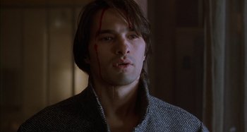 Movie still from “Unfaithful” (2002), directed by Adrian Lyne – A man with blood dripping from his face; Close Up shot, Low angle