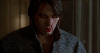 Movie still from “Unfaithful” (2002), directed by Adrian Lyne – A man with blood dripping from his face; Close Up shot, High angle