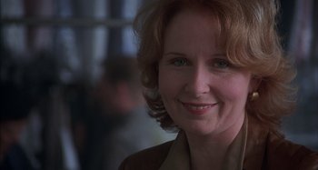 Movie still from “Unfaithful” (2002), directed by Adrian Lyne – A person smiling for the camera; Close Up shot, Over the shoulder angle