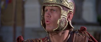 Movie still from “History of the World: Part I” (1981), directed by Mel Brooks – A person wearing a helmet; Close Up shot, Low angle