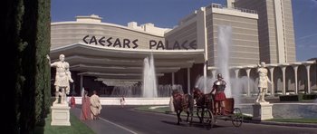 Movie still from “History of the World: Part I” (1981), directed by Mel Brooks – A horse drawn carriage in front of a building; Extreme Wide shot, Low angle