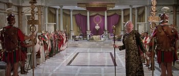 Movie still from “History of the World: Part I” (1981), directed by Mel Brooks – A group of people standing in front of an audience; Extreme Wide shot, High angle