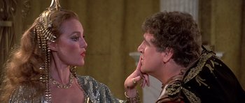 Movie still from “History of the World: Part I” (1981), directed by Mel Brooks – A man and a woman looking at one another; Close Up shot, Over the shoulder angle