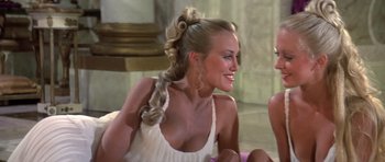 Movie still from “History of the World: Part I” (1981), directed by Mel Brooks – A beautiful blonde woman sitting on the ground; Close Up shot, Over the shoulder angle