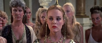 Movie still from “History of the World: Part I” (1981), directed by Mel Brooks – A group of women standing next to each other; Close Up shot, Over the shoulder angle