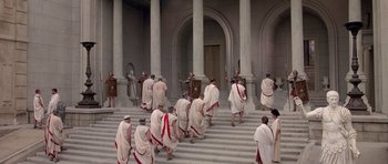 Movie still from “History of the World: Part I” (1981), directed by Mel Brooks – A group of people dressed in ancient roman clothing; Extreme Wide shot, High angle