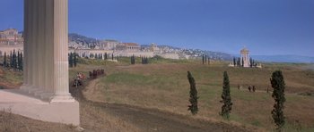 Movie still from “History of the World: Part I” (1981), directed by Mel Brooks – A view of a field with a bunch of trees in the foreground; Extreme Wide shot, High angle