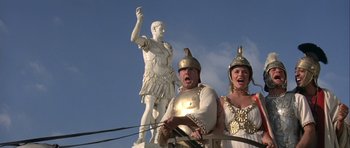 Movie still from “History of the World: Part I” (1981), directed by Mel Brooks – A man and a woman dressed as roman soldiers; Medium shot, Low angle