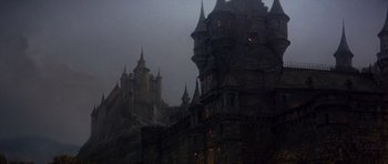 Movie still from “History of the World: Part I” (1981), directed by Mel Brooks – A castle like building in the middle of the night; Extreme Wide shot, Low angle