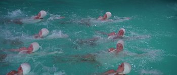 Movie still from “History of the World: Part I” (1981), directed by Mel Brooks – A group of women swimming in a pool; Medium shot, High angle