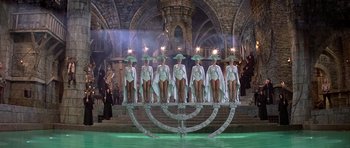 Movie still from “History of the World: Part I” (1981), directed by Mel Brooks – A group of women standing on top of a menorah; Wide shot, High angle