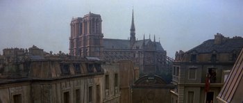 Movie still from “History of the World: Part I” (1981), directed by Mel Brooks – A view of a cathedral from the roof of an old building; Extreme Wide shot, High angle