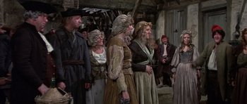 Movie still from “History of the World: Part I” (1981), directed by Mel Brooks – A group of people dressed in medieval clothing; Wide shot, High angle