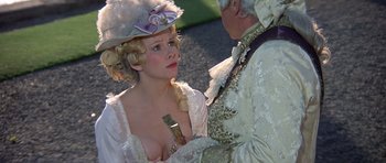 Movie still from “History of the World: Part I” (1981), directed by Mel Brooks – A woman in a white dress and a man in a white suit; Medium shot, Over the shoulder angle