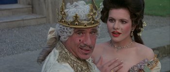 Movie still from “History of the World: Part I” (1981), directed by Mel Brooks – A man and a woman dressed up in costume; Close Up shot, High angle