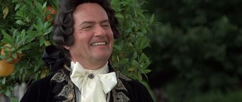 Movie still from “History of the World: Part I” (1981), directed by Mel Brooks – A person wearing a suit and bow tie; Close Up shot, Low angle