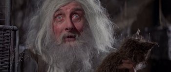 Movie still from “History of the World: Part I” (1981), directed by Mel Brooks – An old man with long white hair and a beard; Close Up shot, Low angle