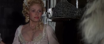 Movie still from “History of the World: Part I” (1981), directed by Mel Brooks – A woman in a white dress with a necklace; Close Up shot, Over the shoulder angle