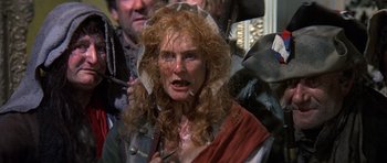 Movie still from “History of the World: Part I” (1981), directed by Mel Brooks – A person wearing a costume; Close Up shot, Over the shoulder angle