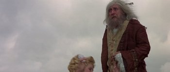 Movie still from “History of the World: Part I” (1981), directed by Mel Brooks – An old man and a young girl are looking at each other; Medium shot, Low angle