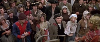Movie still from “History of the World: Part I” (1981), directed by Mel Brooks – A group of people in old - fashioned clothing and hats; Medium shot, High angle