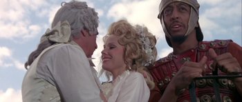Movie still from “History of the World: Part I” (1981), directed by Mel Brooks – A man and a woman dressed in period clothing; Medium shot, Low angle